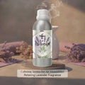 Veena Lavender Premium Fragrance Oil bottle on a display base with an electronic humidifier dispersing a gentle lavender aroma cloud.