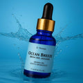 St. Thomas Ocean Breeze Aroma Oil 15ml dynamic splash image with a bright blue water crown background.