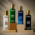 Veena Luxury Oud Fabric Perfume set with White Oud Magic, Oud Malaki, Oud Royal, and Black Oud Wood on aesthetic display blocks.